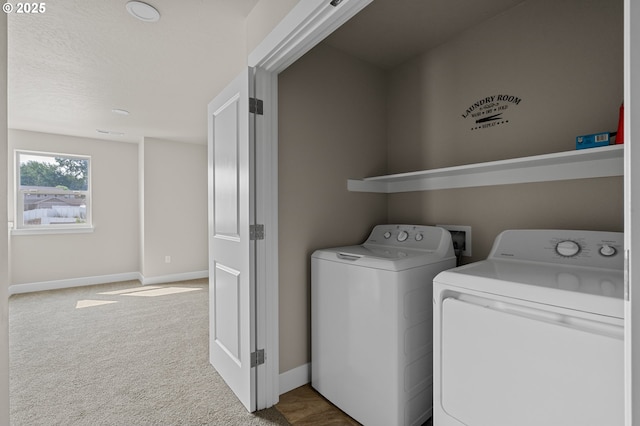 laundry area featuring baseboards, laundry area, washing machine and dryer, and carpet floors
