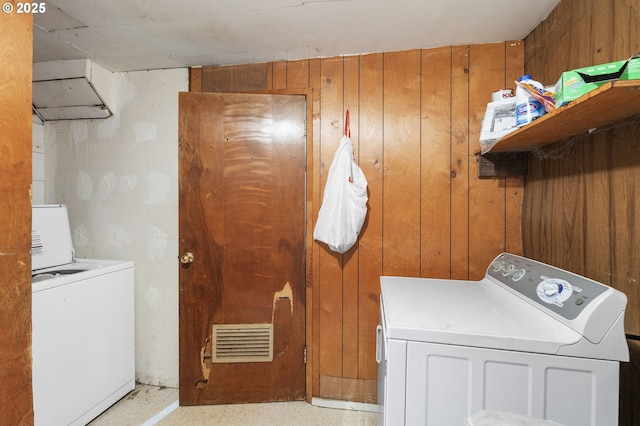 173 N Seneca Rd, Eugene, OR 97402 - laundry room with washing machine and clothes dryer and wooden walls