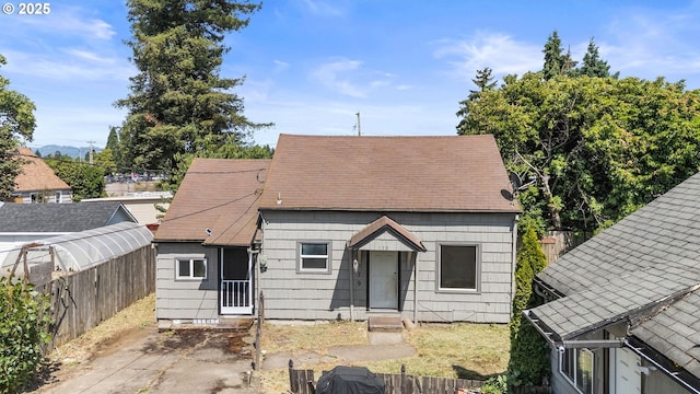 173 N Seneca Rd, Eugene, OR 97402 - rear view of property with an exterior structure and an outdoor structure