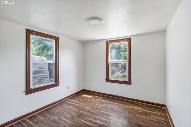 173 N Seneca Rd, Eugene, OR 97402 - unfurnished room featuring dark wood-style flooring and healthy amount of natural light