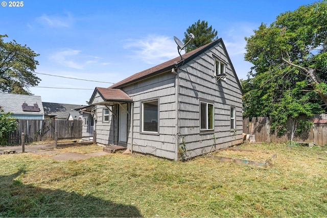 173 N Seneca Rd, Eugene, OR 97402 - view of home's exterior featuring a fenced backyard and a vegetable garden