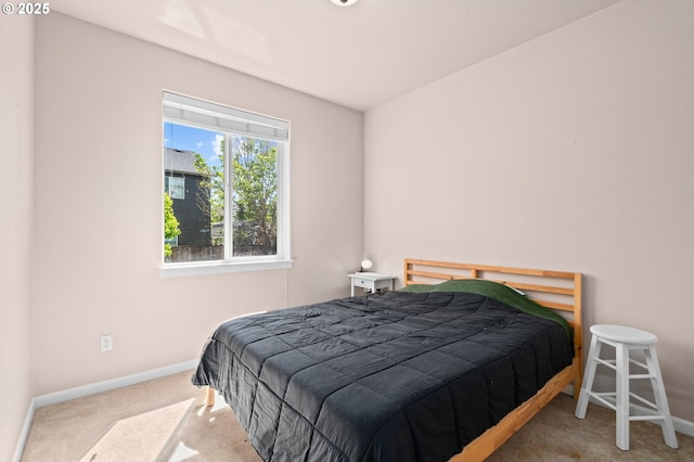 carpeted bedroom with baseboards