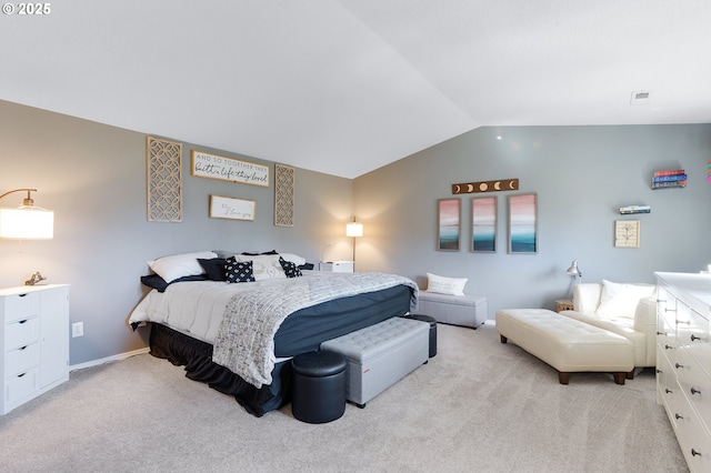 bedroom with visible vents, light colored carpet, baseboards, and vaulted ceiling