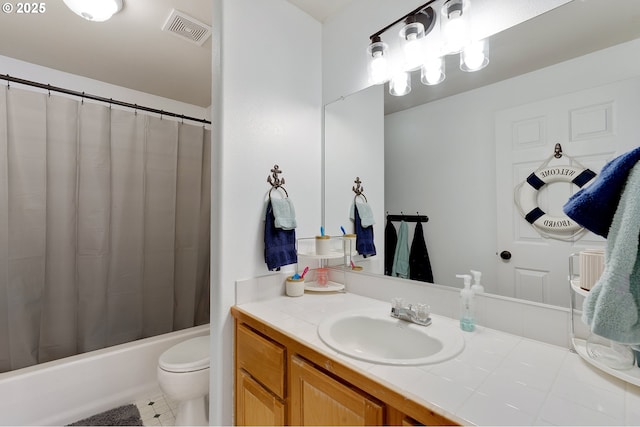 bathroom featuring vanity, visible vents, shower / tub combo, tile patterned floors, and toilet