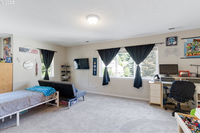 carpeted bedroom featuring visible vents, multiple windows, a textured ceiling, and baseboards