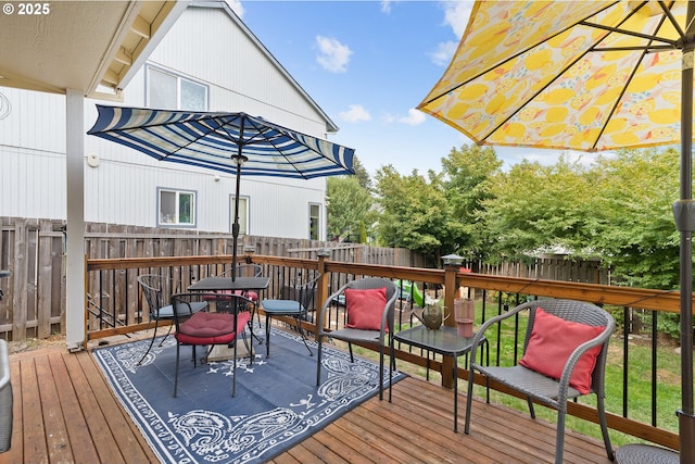 wooden deck featuring fence