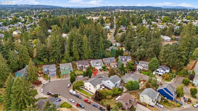 birds eye view of property with a residential view