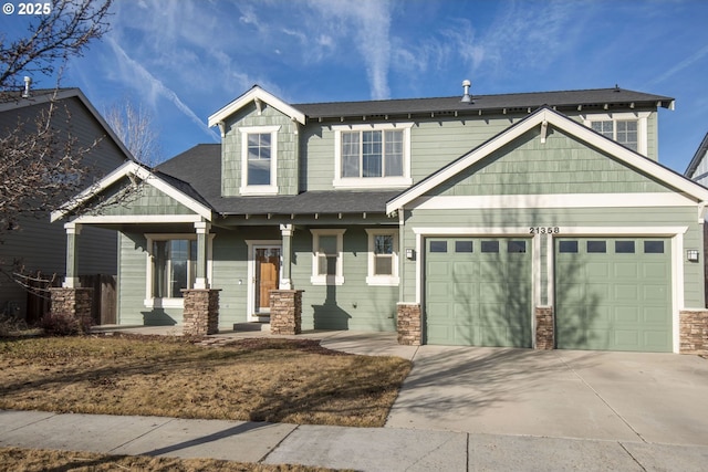 craftsman-style home with a porch and a garage