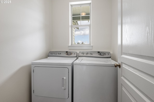 washroom with washer and dryer