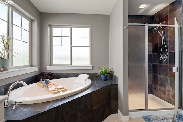 bathroom with shower with separate bathtub