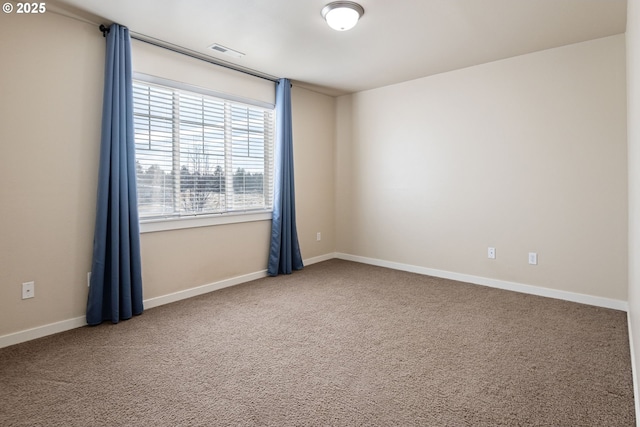 unfurnished room featuring carpet