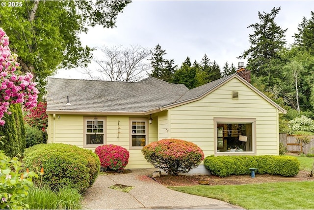 5818 SW Boundary St, Portland, OR 97221 - view of front of property featuring a chimney and roof with shingles
