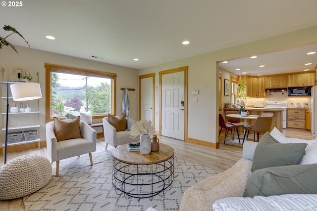 5818 SW Boundary St, Portland, OR 97221 - living room featuring recessed lighting, light wood finished floors, and baseboards