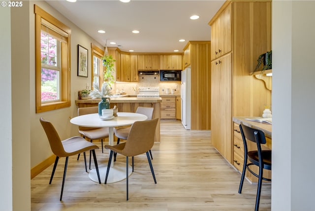 5818 SW Boundary St, Portland, OR 97221 - dining area with light wood-style flooring, recessed lighting, baseboards, and a desk