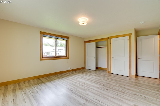 5818 SW Boundary St, Portland, OR 97221 - unfurnished bedroom featuring baseboards, light wood finished floors, and a closet