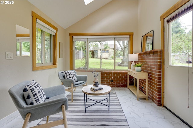 5818 SW Boundary St, Portland, OR 97221 - living area featuring lofted ceiling, a skylight, and baseboards