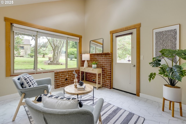 5818 SW Boundary St, Portland, OR 97221 - living room featuring healthy amount of natural light, baseboards, and a high ceiling