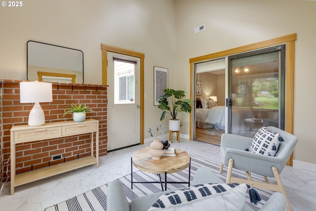 5818 SW Boundary St, Portland, OR 97221 - living room featuring a towering ceiling and baseboards