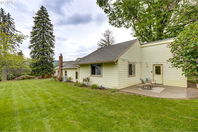 5818 SW Boundary St, Portland, OR 97221 - rear view of property with a lawn, a patio area, a chimney, cooling unit, and roof with shingles