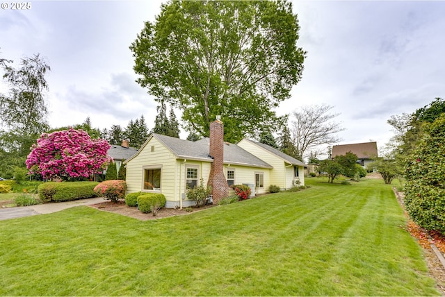 5818 SW Boundary St, Portland, OR 97221 - view of front of home featuring a front yard and a chimney