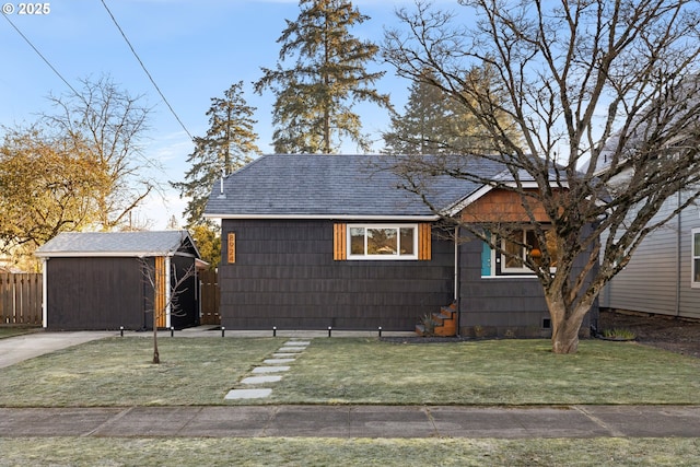 view of front of property with a front yard and a storage unit