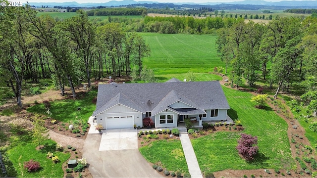 drone / aerial view featuring a rural view and a mountain view