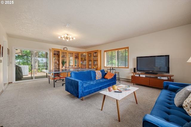 living area featuring carpet floors, a textured ceiling, a wealth of natural light, and baseboard heating