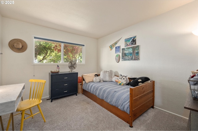 bedroom featuring light colored carpet