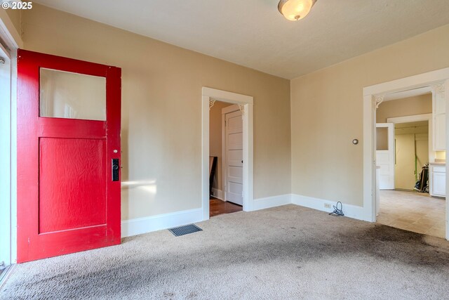 interior space with baseboards and visible vents