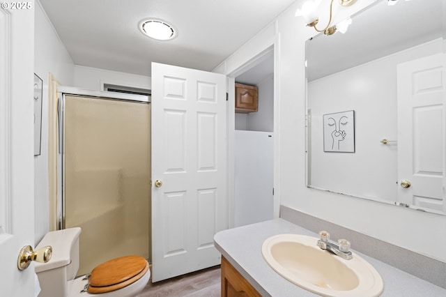 33385 Craig Loop, Cottage Grove, OR 97424 - full bath with vanity, a stall shower, toilet, and wood finished floors