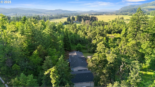 33385 Craig Loop, Cottage Grove, OR 97424 - aerial view of property and surrounding area with a mountain backdrop and a heavily wooded area