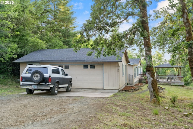 33385 Craig Loop, Cottage Grove, OR 97424 - view of home's exterior featuring driveway, a wooden deck, and a shingled roof