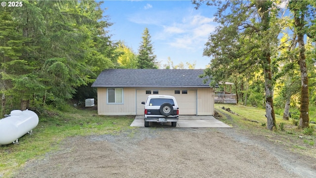 33385 Craig Loop, Cottage Grove, OR 97424 - garage with dirt driveway and central air condition unit