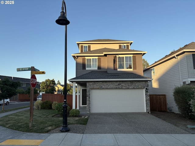 13622 SE Siskin Ln, Happy Valley, OR 97015 - view of front of property with a garage, driveway, and stone siding