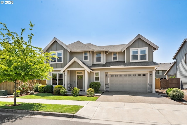 12209 Mimosa Way, Oregon City, OR 97045 - view of front of house featuring board and batten siding, driveway, an attached garage, and stone siding
