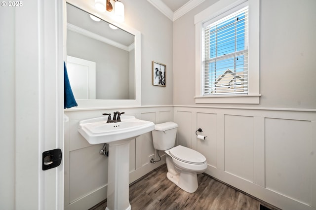 12209 Mimosa Way, Oregon City, OR 97045 - bathroom featuring crown molding, toilet, a wainscoted wall, wood finished floors, and a decorative wall