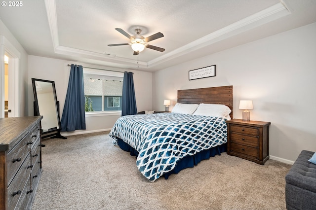 12209 Mimosa Way, Oregon City, OR 97045 - carpeted bedroom featuring a tray ceiling, baseboards, ornamental molding, and ceiling fan