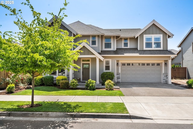 12209 Mimosa Way, Oregon City, OR 97045 - view of front of home with board and batten siding, asphalt driveway, an attached garage, and a shingled roof