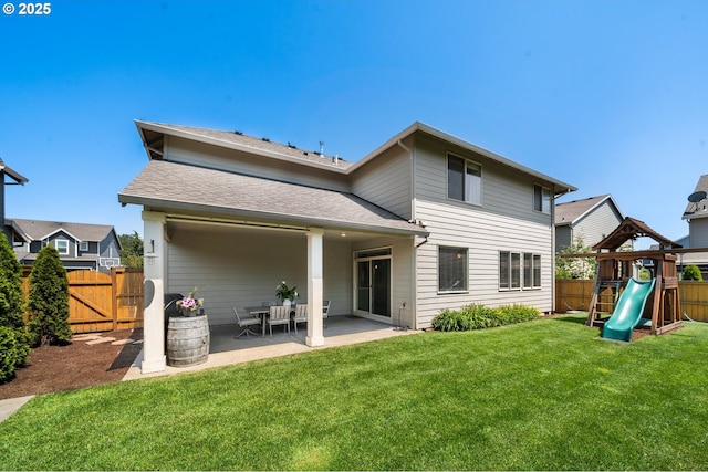 12209 Mimosa Way, Oregon City, OR 97045 - back of property with a patio area, a playground, a gate, and a shingled roof