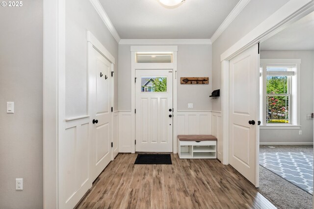 12209 Mimosa Way, Oregon City, OR 97045 - foyer featuring crown molding, wood finished floors, and a wainscoted wall