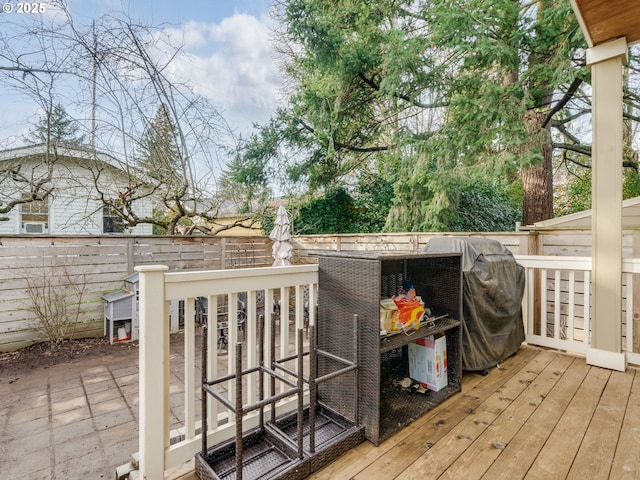 wooden deck featuring grilling area