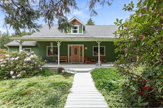 26011 S Morgan Rd, Estacada, OR 97023 - view of front of property with stucco siding, roof with shingles, and a porch