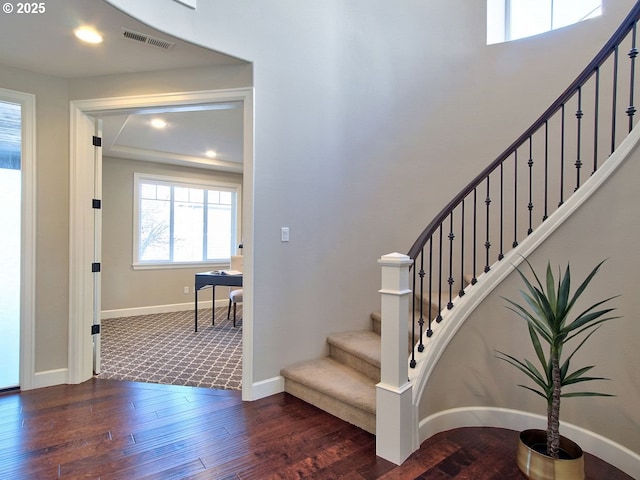 stairs featuring recessed lighting, wood finished floors, visible vents, and baseboards