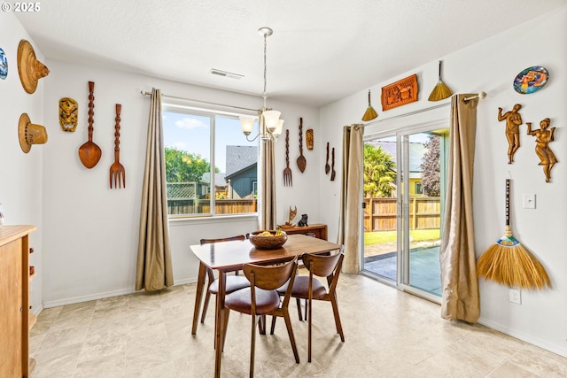 5739 Donohoe Ave, Eugene, OR 97402 - dining space with a chandelier and healthy amount of natural light