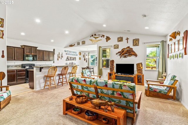 5739 Donohoe Ave, Eugene, OR 97402 - living area with light colored carpet, lofted ceiling, and recessed lighting