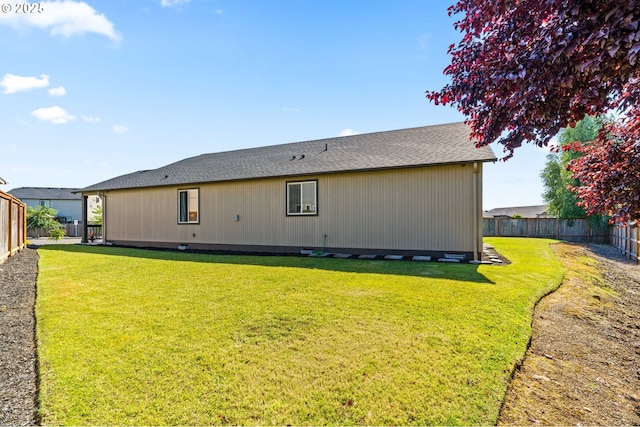 5739 Donohoe Ave, Eugene, OR 97402 - back of house with a fenced backyard and a shingled roof