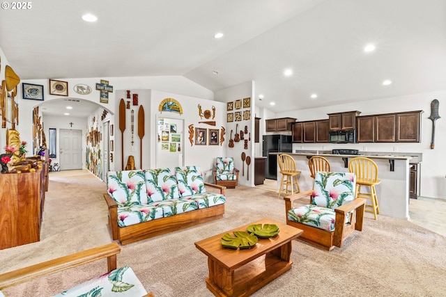 5739 Donohoe Ave, Eugene, OR 97402 - living room with lofted ceiling, arched walkways, light colored carpet, and recessed lighting