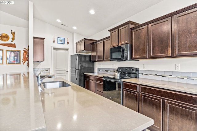 5739 Donohoe Ave, Eugene, OR 97402 - kitchen with black appliances, vaulted ceiling, dark brown cabinets, recessed lighting, and light countertops