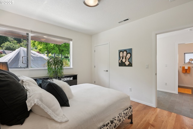 14569 NW Larson Rd Unit 13, Portland, OR 97231 - bedroom with wood finished floors and baseboards