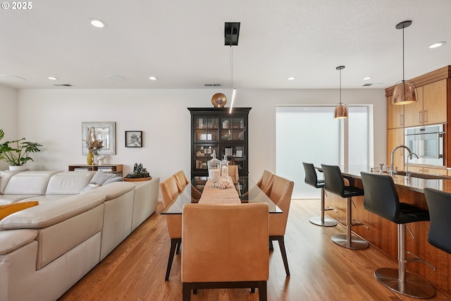 14569 NW Larson Rd Unit 13, Portland, OR 97231 - dining room featuring light wood finished floors and recessed lighting